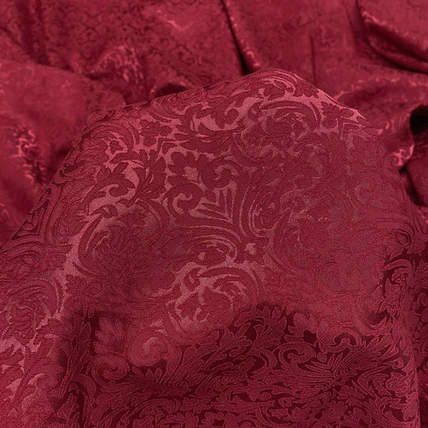 Richly textured burgundy jacquard fabric by the yard