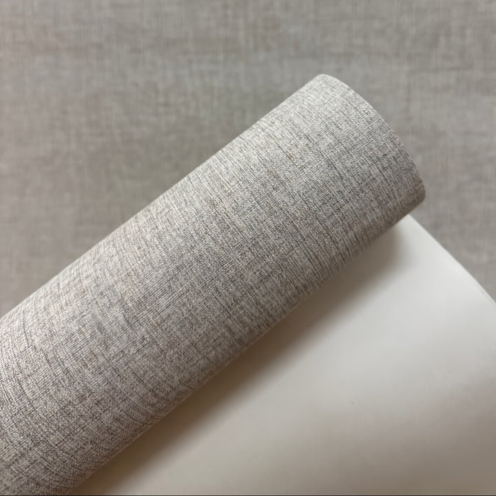 Faux linen textured wallpaper applied on bedroom wall

