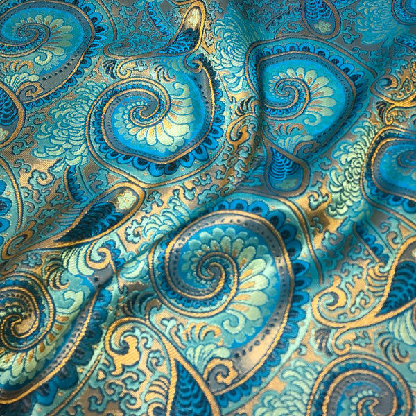 Luxury blue satin brocade fabric with paisley jacquard pattern and glossy finish